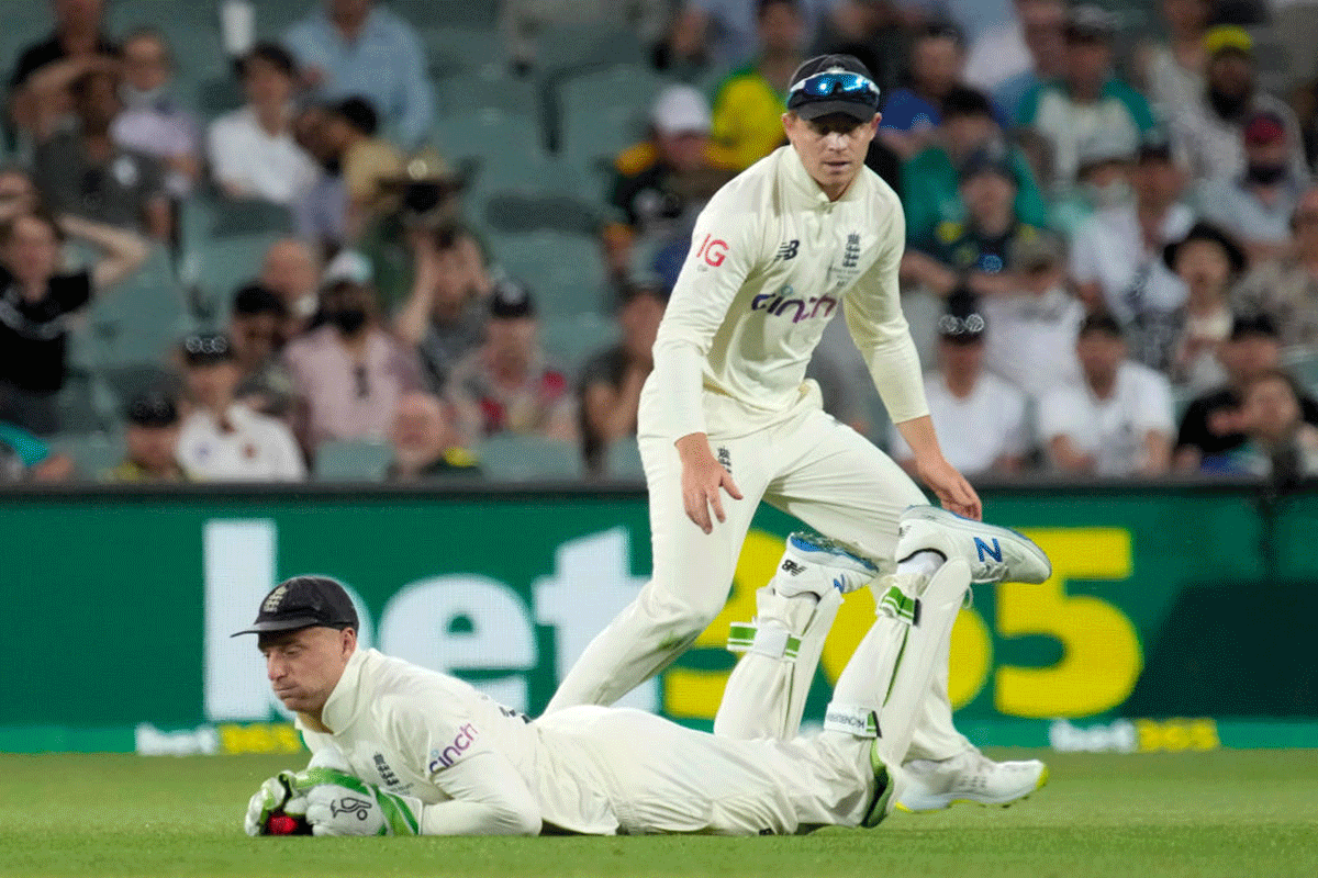 Jos Buttler puts down Marnus Labuschagne off the bowling of James Anderson