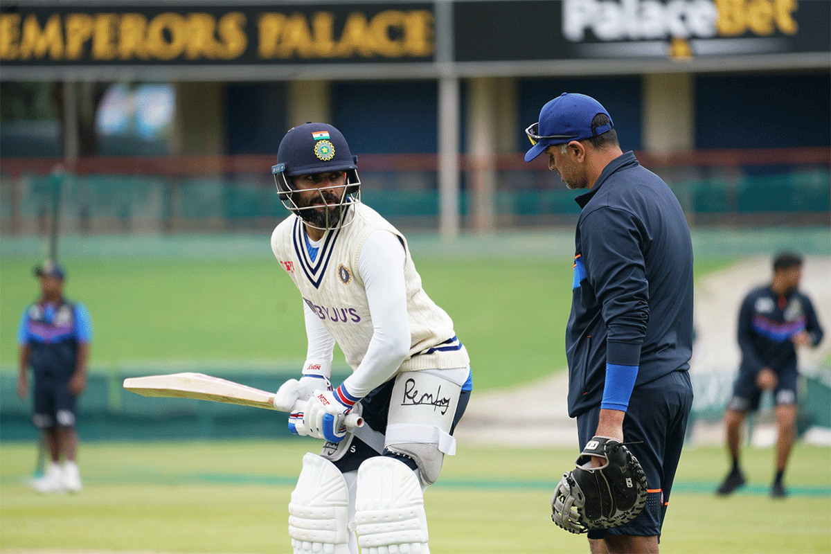Rahul Dravid watches with a keen eye as Virat Kohli bats in the nets on Monday