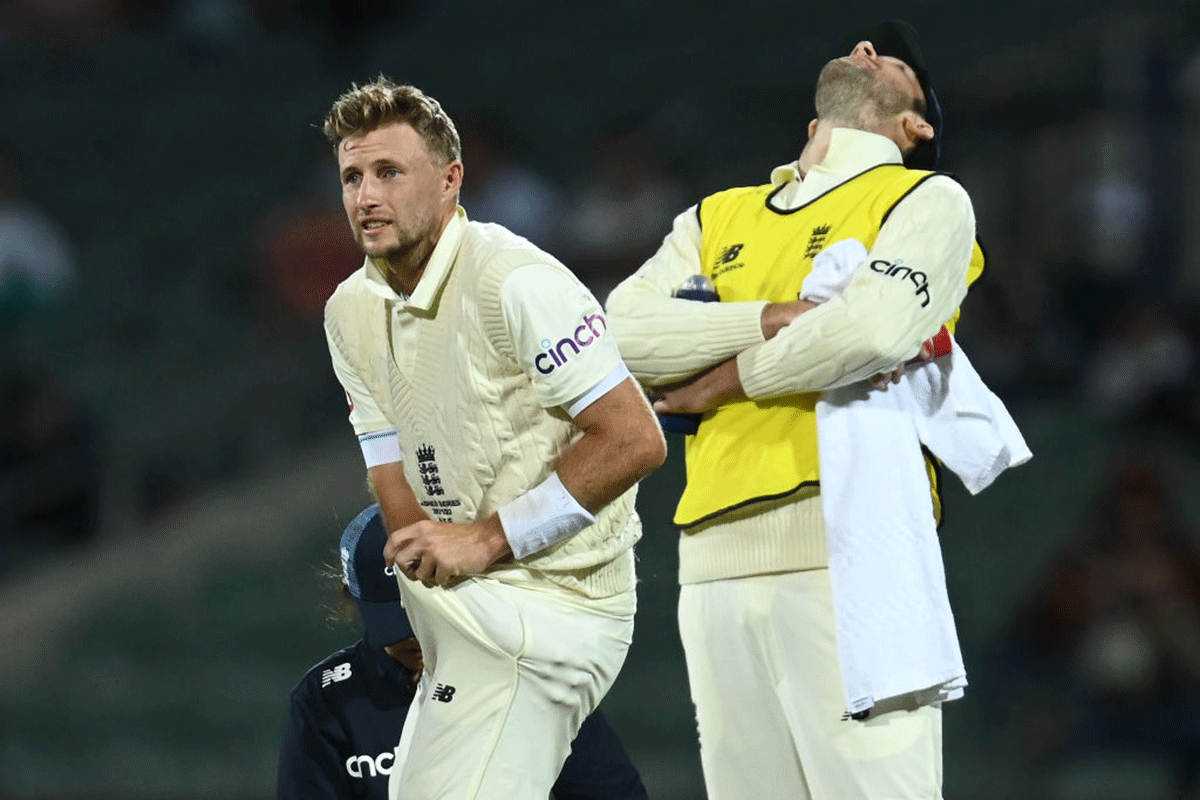Joe Root checks his cricket groin box after being hit by a delivery by Mitchell Starc on Day Four of the 2nd Ashes Test at Adelaide Oval on Sunday