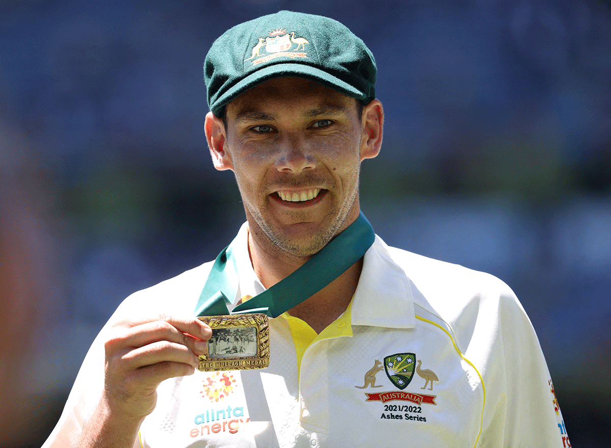 Australia's Scott Boland celebrates with the Mullagh Medal after winning the match at the MCG 