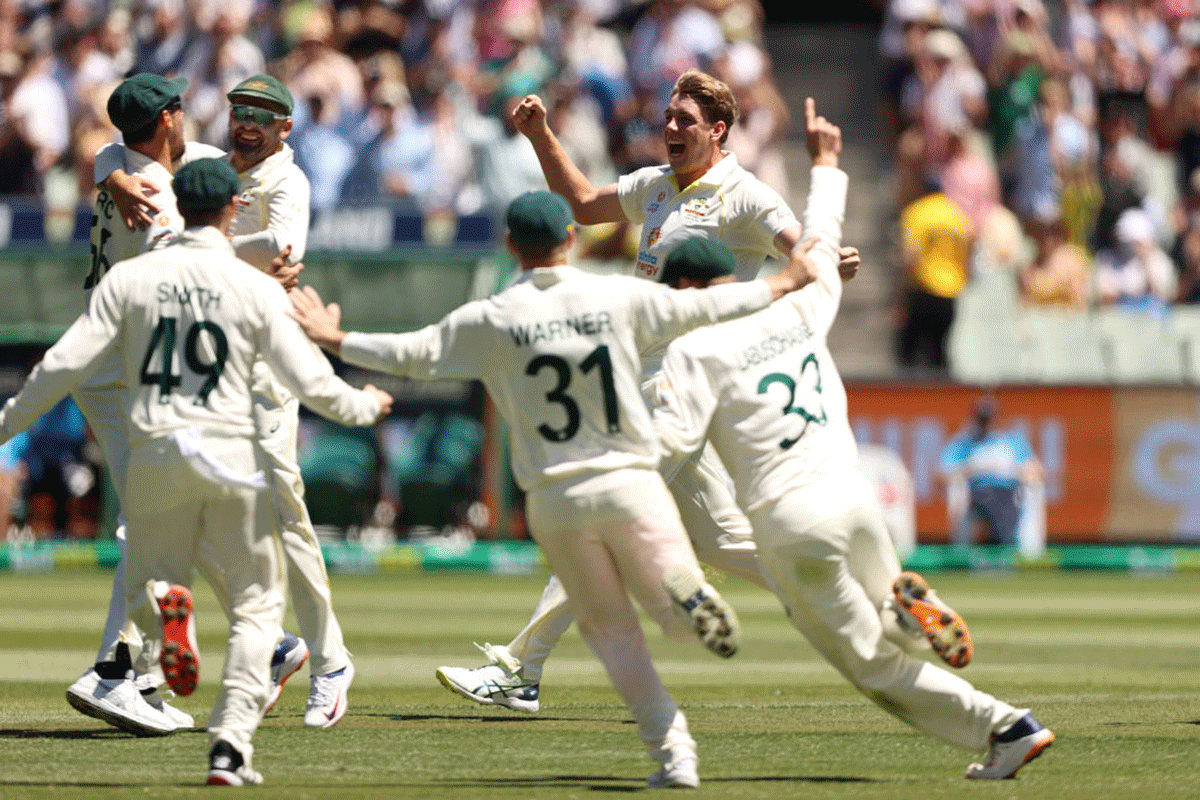 Australia's Cameron Green celebrates with teammates after dismissing England's James Anderson to retain the Ashes