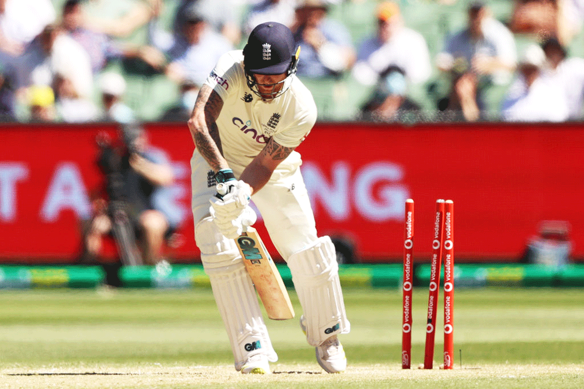 England's Ben Stokes is bowled out by Australia's Mitchell Starc during day three of the Third Ashes Test match at Melbourne Cricket Ground in Melbourne, Australia, on Tuesday
