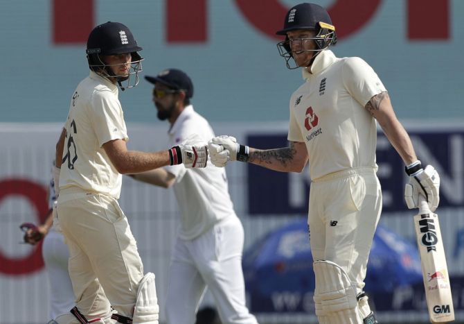 Ben Stokes and Joe Root celebrate a boundary. 