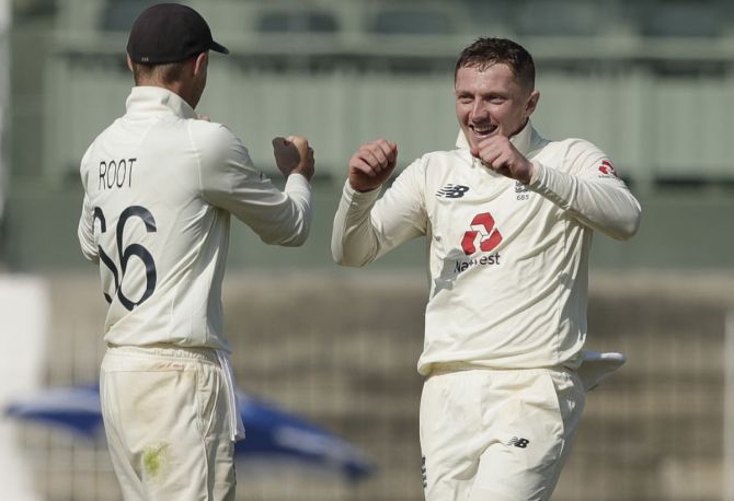 Dom Bess celebrates with Joe Root after taking the wicket of Cheteshwar Pujara