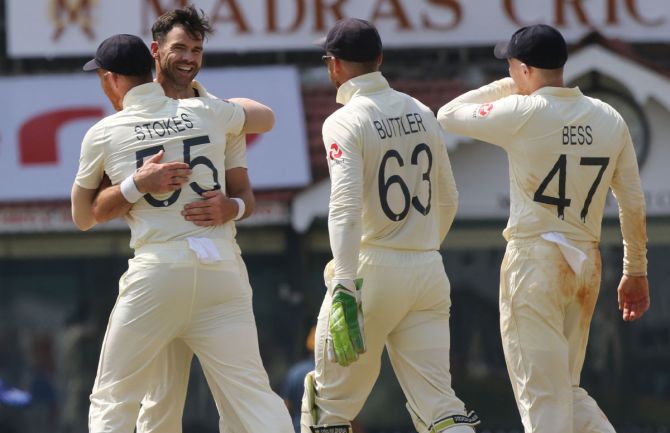 James Anderson and Ben Stokes celebrate the wicket of Jasprit Bumrah