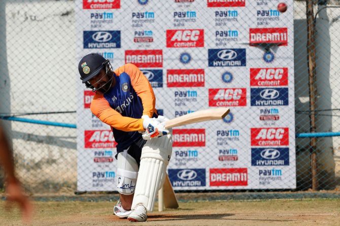 Rohit Sharma practices the sweep shot at a practice session on Friday