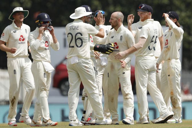 Jack Leach is congratulated by his England teammates after dismissing Cheteshwar Pujara