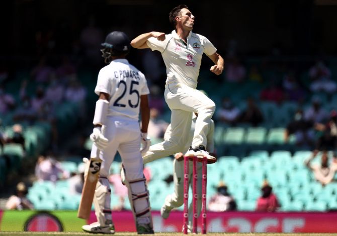 Australia pacer Pat Cummins celebrates after dismissing Cheteshwar Pujara on Day 3 of the third Test against India, at the Sydney Cricket Ground, on Saturday. 