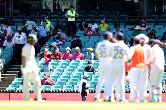 India's players watch from the middle as security personnel eject spectators from the Sydney Cricket Ground for allegedly abusive comment directed at pacer Mohammed Siraj on Day 4 of the third Test.
