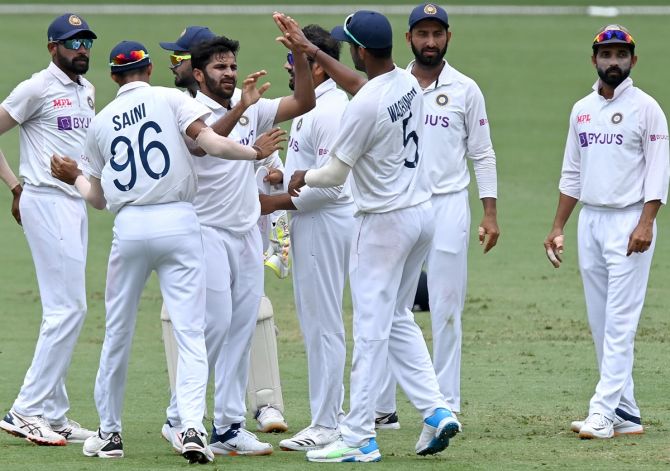 Shardul Thakur is complimented by his India teammates after dismissing Marcus Harris.