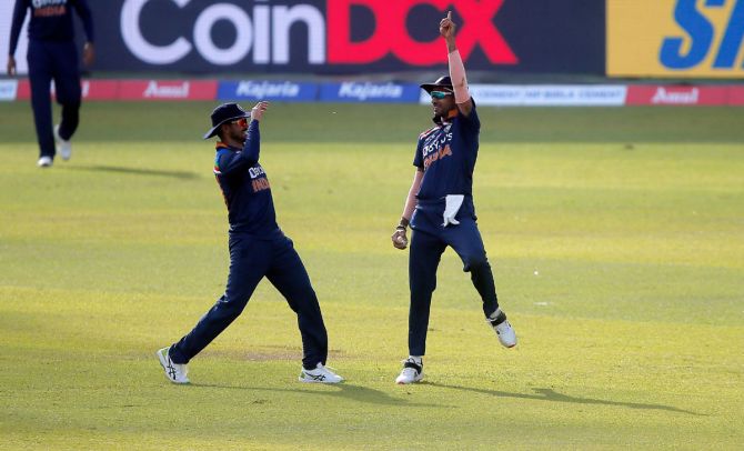 Shikhar Dhawan celebrates taking a catch to dismiss Sri Lanka's Bhanuka Rajapaksa 