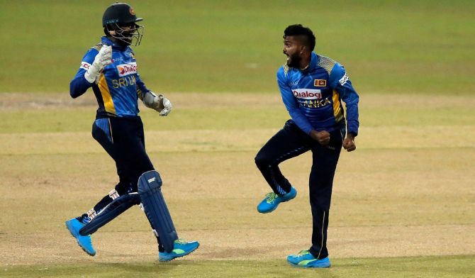 Sri Lanka's Wanindu Hasaranga celebrates with teammates after taking the wicket of India's Prithvi  Shaw. Dinuka Liyanawatte