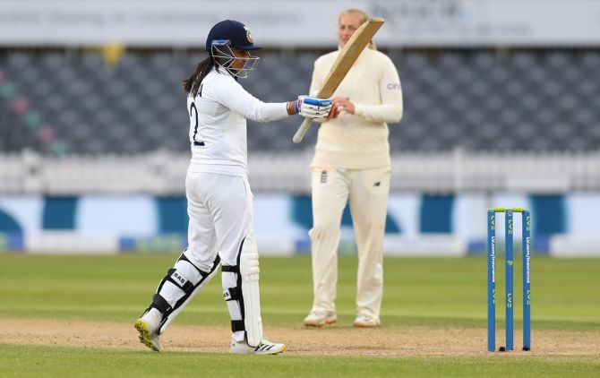India's Sneh Rana waves to the dressing room after getting to 50 on Day 4 of the one-off women's Test against England, at Bristol County Ground, on Saturday