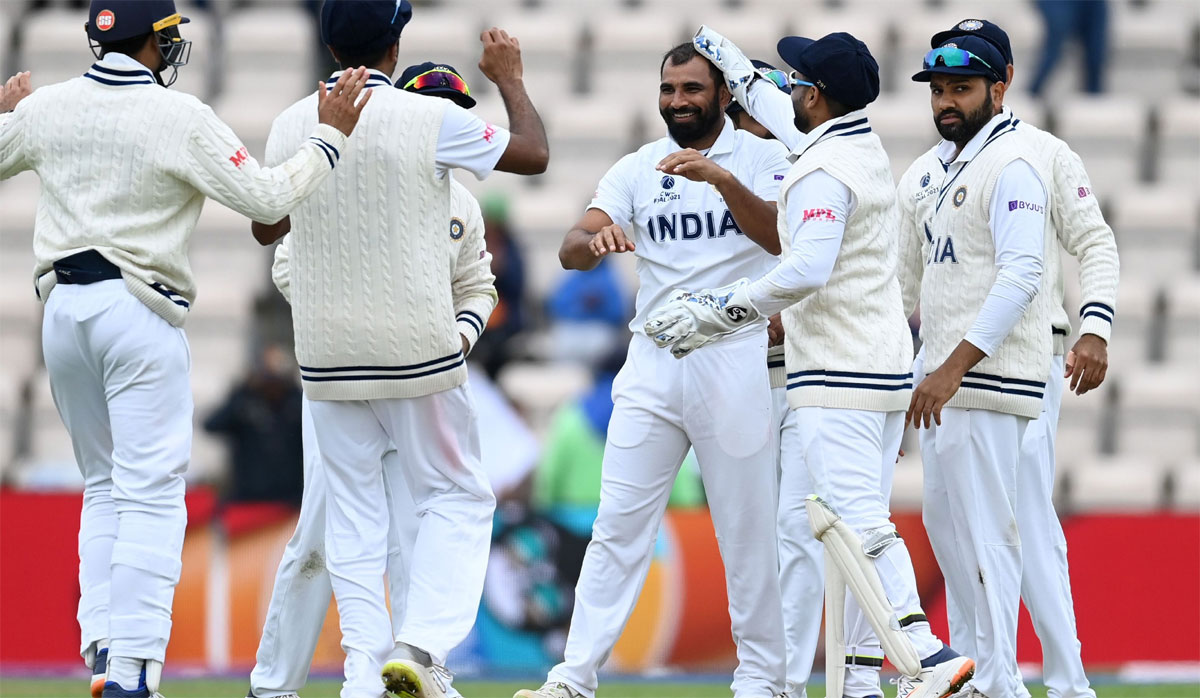 India's players celebrate after Mohammed Shami dismisses B J Watling