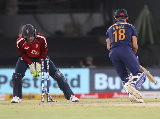 Virat Kohli is stumped by England wicketkeeper Jos Buttler