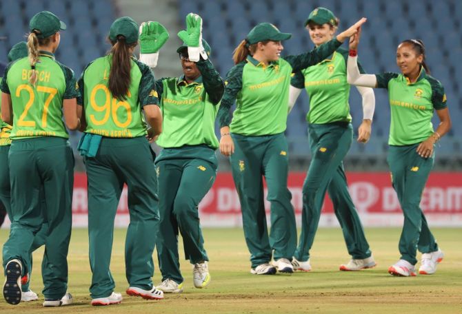 South Africa's players celebrate the fall of a wicket