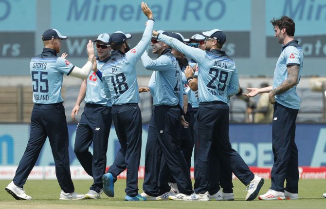 England players celebrate the wicket of Shikhar Dhawan
