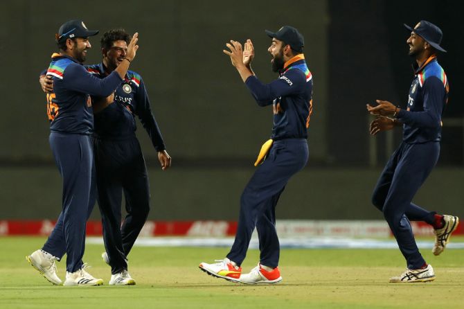India players celebrate the run out of Jason Roy