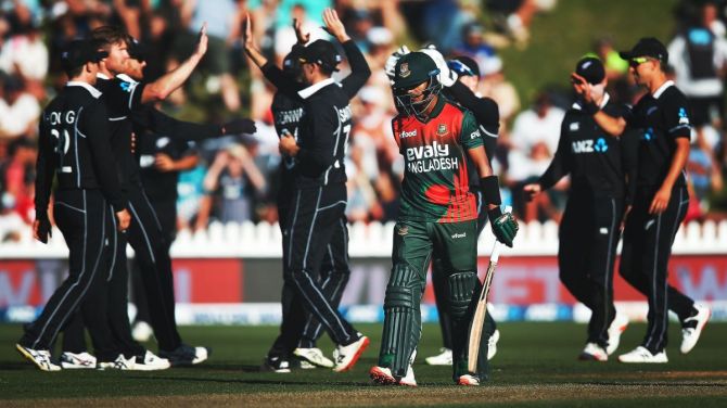 New Zealand's Jimmy Neesham celebrates with teammates on taking a wicket in the third ODI against Bangladesh on Friday