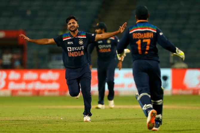 Shardul Thakur celebrates after dismissing a well-set David Malan in the third One-Day Internationl against England, in Pune, on Sunday.