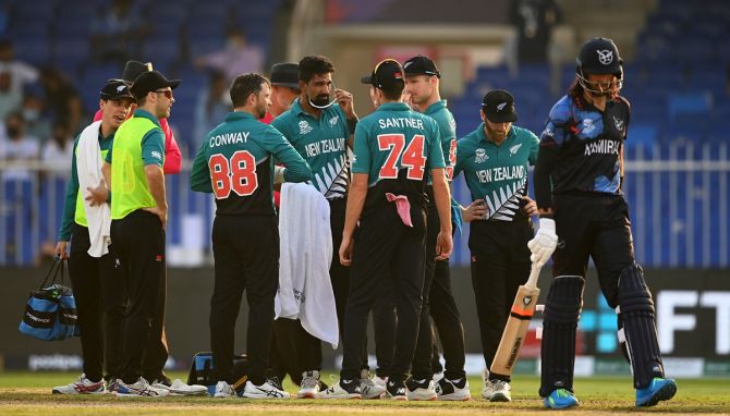 New Zealand spinner Ish Sodhi is checked by medical staff after being hit on the head by a shot from David Wiese.