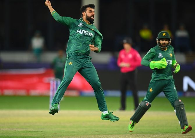 Pakistan spinner Shadab Khan, who finished with four wickets for 26 runs, celebrates after dismissing Australia opener David Warner 