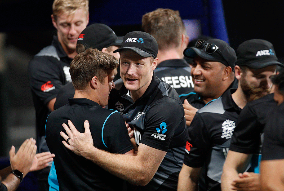 New Zealand's Jimmy Neesham celebrates with teammates after their semi-final win over England on Wednesday
