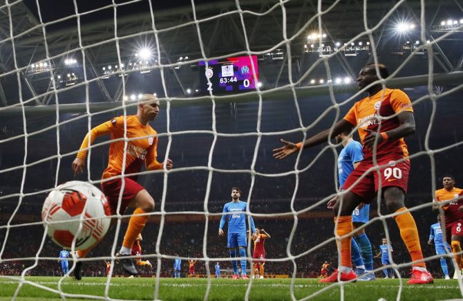 Sofiane Feghouli celebrates scoring Galatasaray's third goal in the Europa League Group E match against Olympique de Marseille