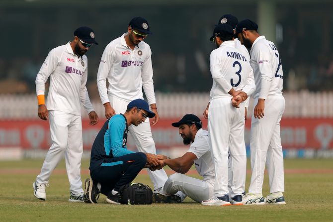 India pacer Ishant Sharma receives medical attention after hurting his finger while fielding.