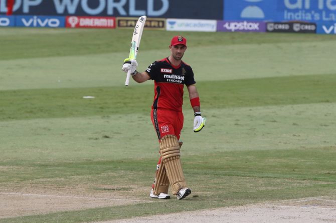Royal Challengers Bangalore batter Glenn Maxwell celebrates scoring 50 during the Indian Premier League match against Punjab Kings, in Sharjah, on Sunday.