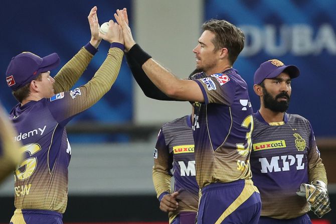 Kolkata Knight Riders pacer Tim Southee celebrates with skipper Eoin Morgan after trapping Sunrisers Hyderabad opener Wriddhiman Saha leg before wicket with the second delivery of the innings in the Indian Premier League match, in Dubai, on Sunday.