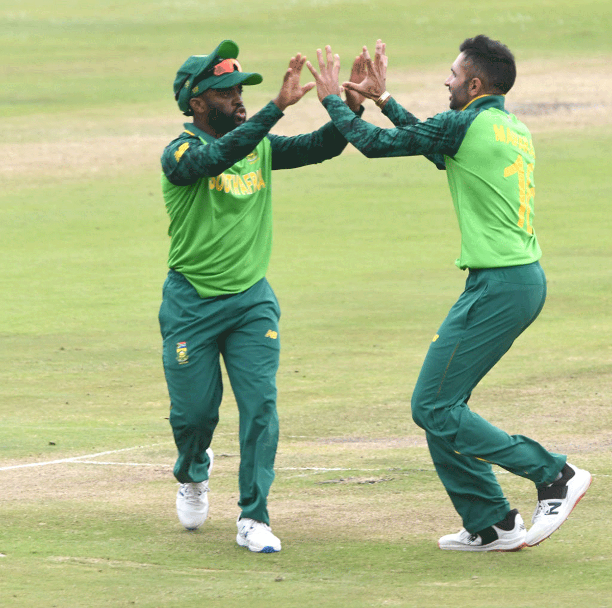 South Africa captain Temba Bavuma celebrates a wicket with teammate Keshav Maharaj.  'I don't harp on a lot about being a Black African but it is quite significant, from all angles. Thinking about it now, it adds to the pressure that is already there.'