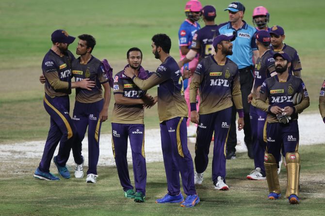 Kolkata Knight Riders players rejoice after scoring a resounding victory over Rajasthan Royals in the Indian Premier League match, in Sharjah, on Thursday