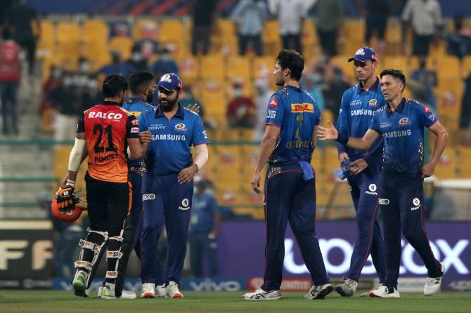 Mumbai Indians skipper Rohit Sharma congratulates Sunrisers Hyderabad's Manish Pandey on his fine knock at the end of the concluding round-robin league match in the Indian Premier Leage in Abu Dhabi on Friday.