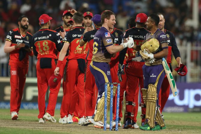 Shakib Al Hasan and Eoin Morgan celebrate after Kolkata Knight Riders clinch victory over Royal Challengers Bangalore in the Indian Premier League 'Eliminator', in Sharjah, on Monday.