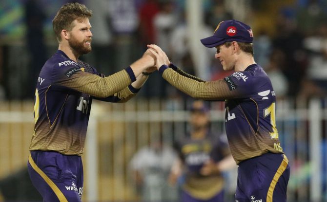 Lockie Ferguson celebrates with Eoin Morgan after taking the wicket of Rishabh Pant.