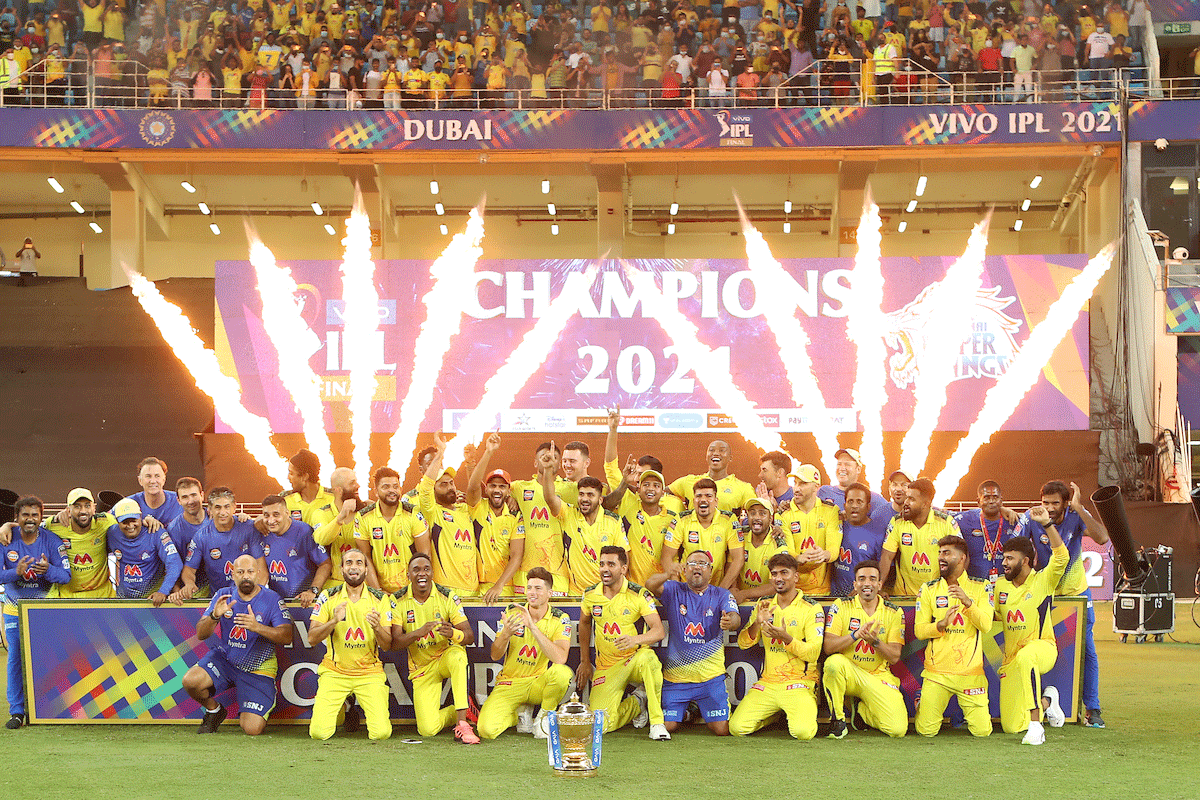 Chennai Super Kings players celebrate with the trophy after winning the IPL final in Dubai on Friday