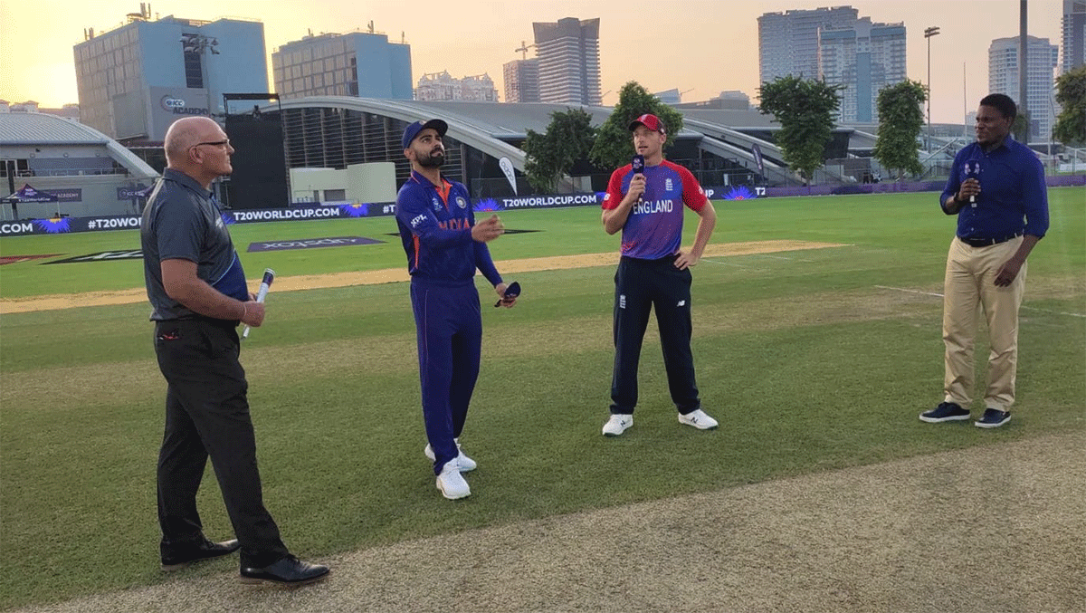 India captain Virat Kohli and England's Jos Buttler at the toss ahead of their T20 World Cup warm-up match in Dubai on Monday