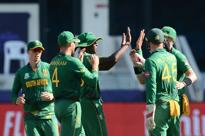 South Africa's players celebrate the fall of a West Indies wicket during the T20 World Cup Super 12s match, at Dubai International Stadium, on Tuesday.