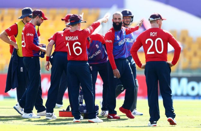 England spinner Moeen Ali celebrates with teammates after dismissing Bangladesh opener Mohammad Naim.