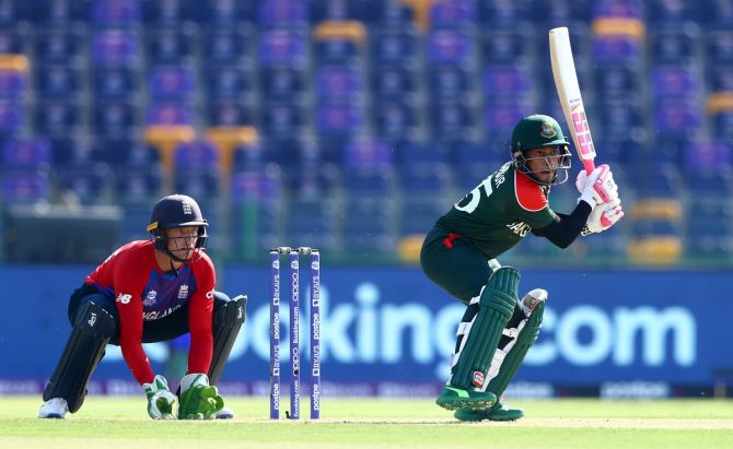 Bangladesh's Mushfiqur Rahim plays a shot as England wicketkeeper Jos Buttler looks on. 