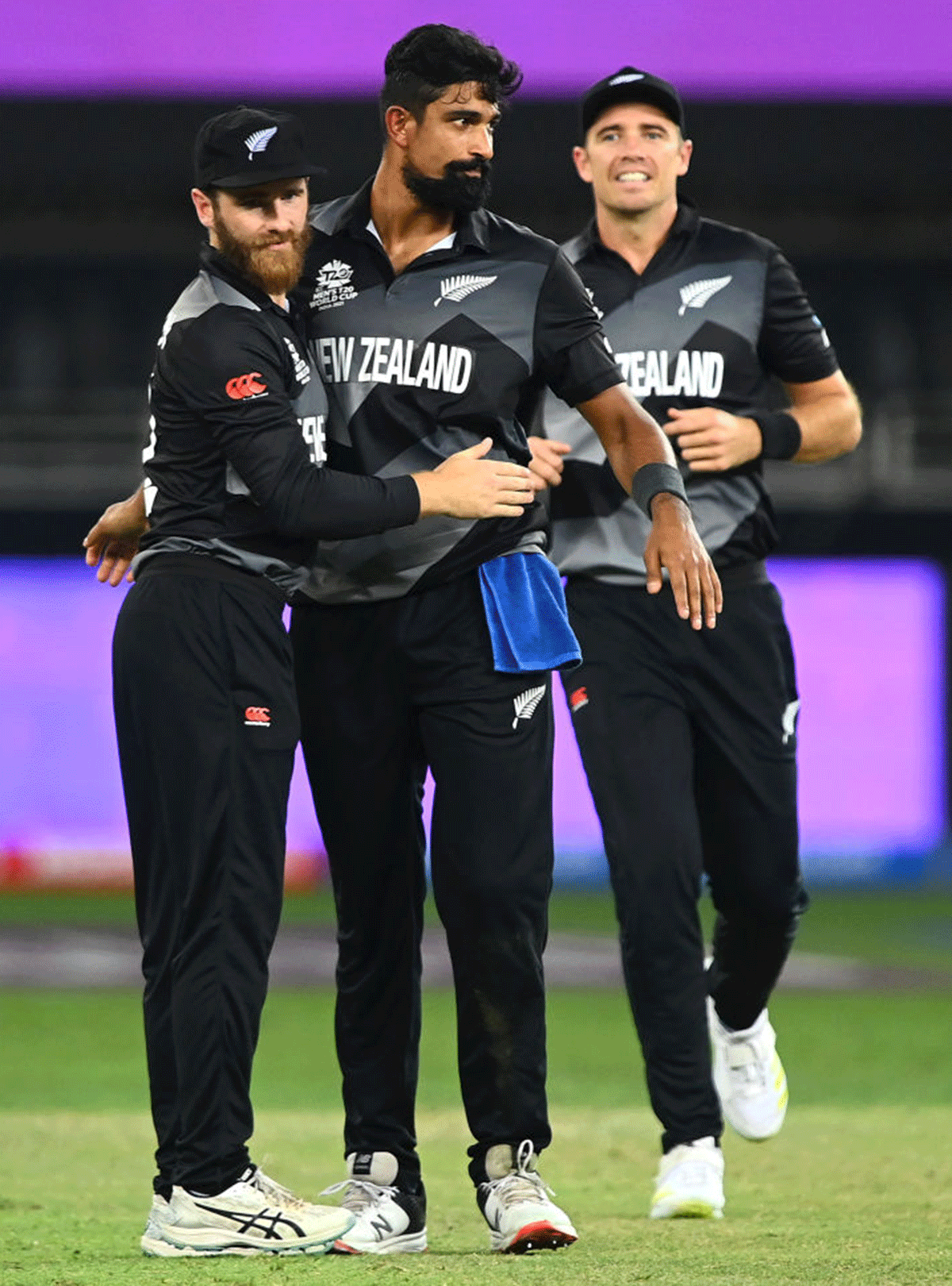 New Zealand's Ish Sodhi celebrates with captain Kane Williamson after dismissing India captain Virat Kohli