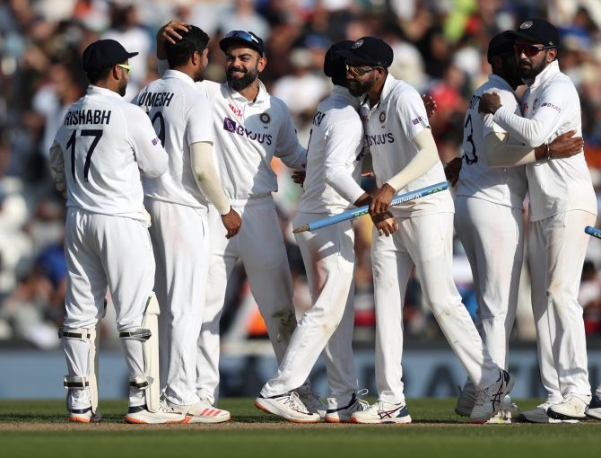 Virat Kohli celebrates with his India teammates after victory over England on Day 5 of the fourth Test, at the Kia Oval in London, on Monday.