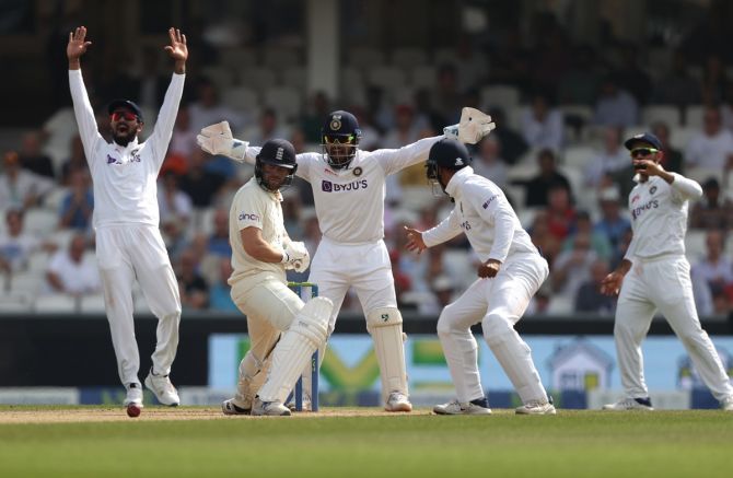 India's players appeal for leg before wicket against Dawid Malan.