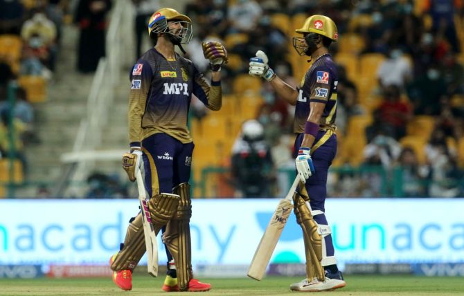 Kolkata Knight Riders openers Venkatesh Iyer and Shubman Gill celebrate a boundary during the IPL match against Royal Challengers Bangalore, in Abu Dhabi, on Monday.