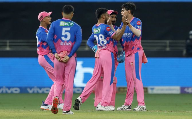 Kartik Tyagi celebrates with teammates after taking the wicket of Deepak Hooda.