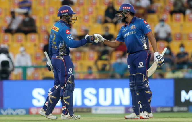 Mumbai Indians openers Rohit Sharma and Quinton de Kock celebrate their 50-run partnership during the Indian Premier league, in Abu Dhabi, on Thursday.