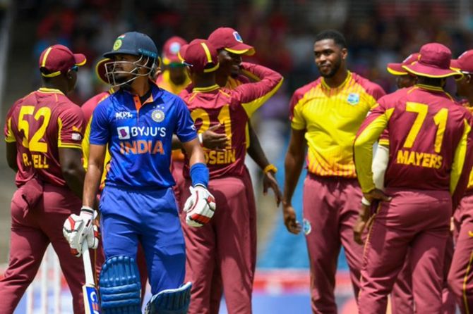 India's Shreyas Iyer walks back as West Indies players celebrate during the second T20I in St Kitts on Monday.
