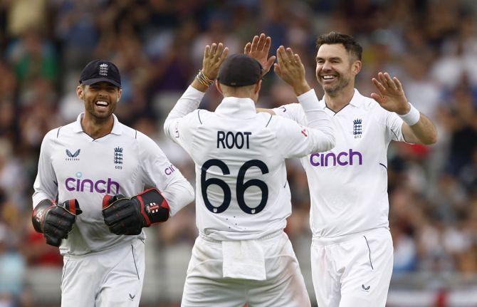 James Anderson celebrates with his England teammates after dismissing South Africa's Simon Harmer on Saturday, Day 3 of the second Test, at Old Trafford, Manchester.