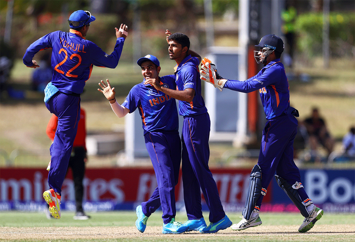 India Under-19 players celebrate the fall of an Australian wicket during the ICC Under-19 World Cup semi-final in Osbourn, Antigua, on Wednesday 